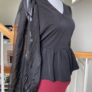 Black blouse with sheer puff sleeves